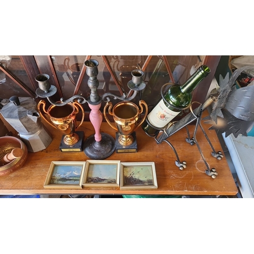 946 - Collection of eclectic items including two brass trophies, a metal wine holder, a pair of candelabra... 