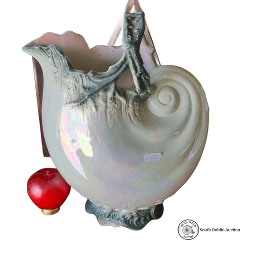 947 - Antique ceramic shell-shaped pitcher with iridescent glaze, featuring intricate detailing and marked... 