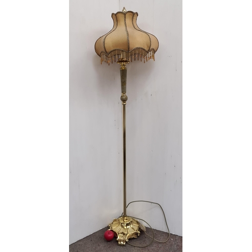 394 - Star Lot : A lovely antique floor lamp with a lovely cast brass base and shade.