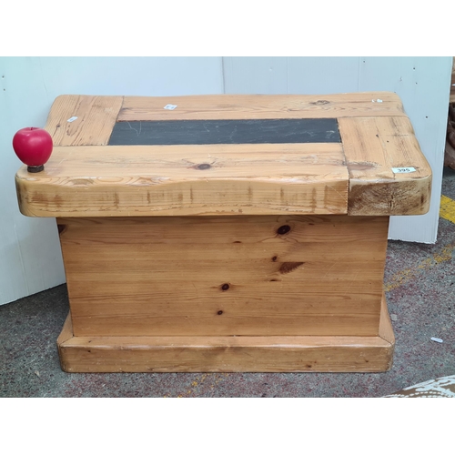 395 - A solid pine coffee table with slate insert to centre. Nice rustic piece.