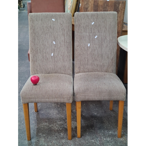 396 - A pair of comfortable dining chairs with solid beechwood legs and suede and hardwearing upholstery.