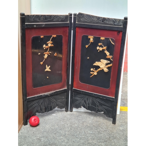 504 - A very pretty example of a Japanese  wooden two panel folding screen showcasing hand carved wooden b... 