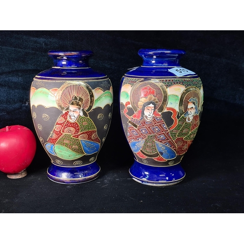 515 - A pair of fascinating cobalt blue ovoid shaped moriage Satsuma vases, with hand-painted animated Jap... 