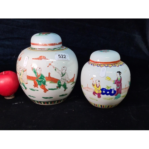 522 - Star Lot : A pair of vintage Chinese Famille Verte ginger jars with lids, each decorated with playfu... 