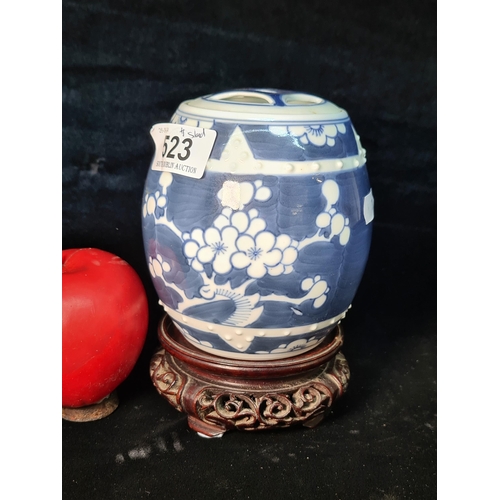 523 - A very pretty example of a Chinese Blue and White ginger jar in the typical prunus pattern. Filled w... 