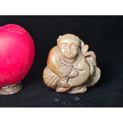 529 - An antique  sweet hand carved natural jade stone amulet depicting fish and baby.