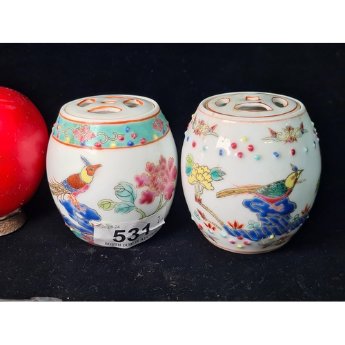 531 - A lovely pair of miniature Chinese hand painted famille rose porcelain lidded jars. Both stamped to ... 