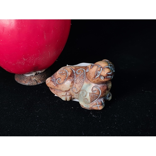 541 - A finely carved jadeite Japanese netsuke of a fu dog. (Netsukes are used with Japanese Kimonos as a ... 