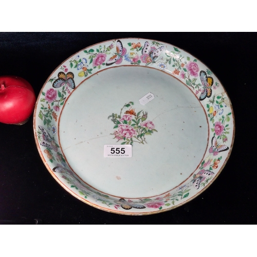 555 - A large stunning hand painted Chinese ceramic dish featuring flowers and butterflies in soft shades ... 