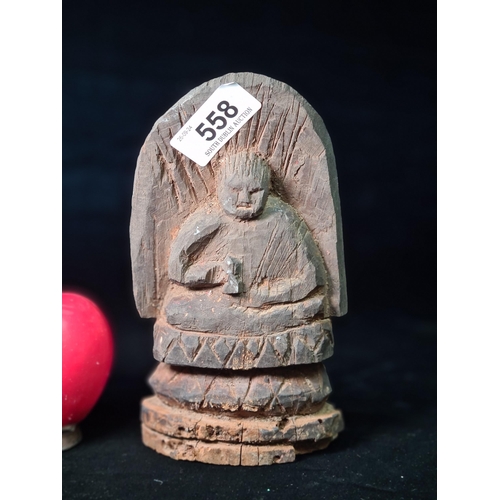 558 - Star Lot A very early possibly 17th century Japanese hand carved wooden sculpture. Features a seated... 