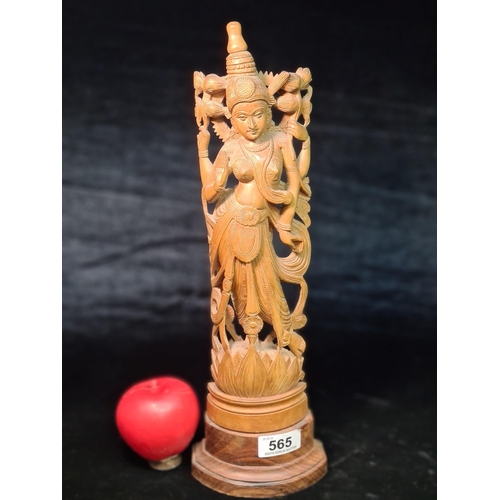 565 - A vintage hard carved statue depicting Lakshmi, also known as Shri who is one of the principal godde... 