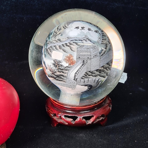 577 - A hand blown reverse painted Great Wall of China glass globe / paperweight. This piece is hollowed o... 