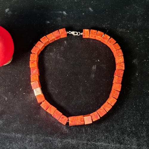 580 - A most unusual red coral cube beaded necklace with sterling silver lobster clasp. Total length 51cm.