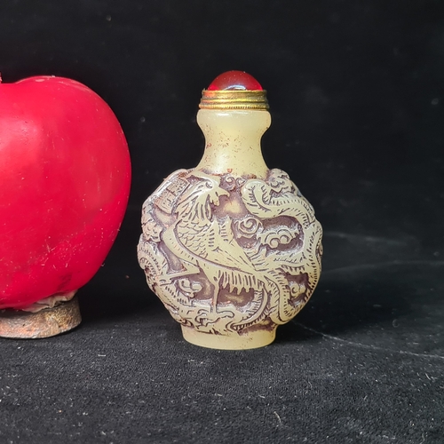 591 - A Chinese vintage carved snuff bottle featuring the phoenix, complete with spoon stopper and red gem... 