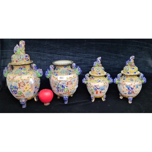 602 - Four antique Japanese Satsuma Moriage vases varying in sizes, three of which have lids. All depict t... 