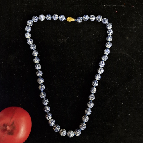 635 - A gorgeous Chinese blue and white porcelain beaded necklace with gilded silver box clasp.