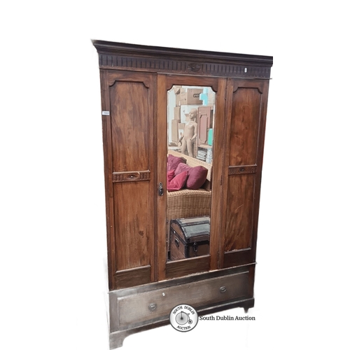 1024 - Early 20th-century mahogany wardrobe with carved details, mirrored central door, and single lower dr... 