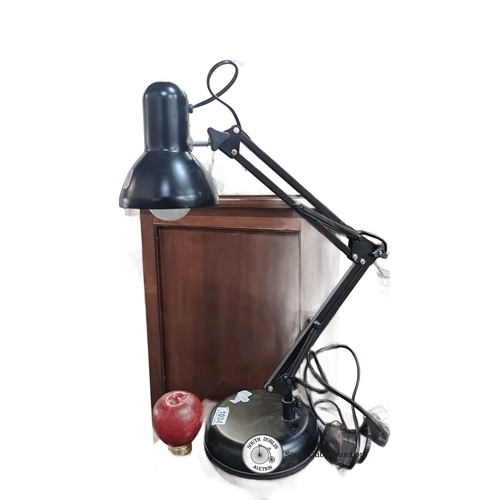 1034 - Adjustable black desk lamp with a weighted base and an articulated arm. It has a single bulb design ... 