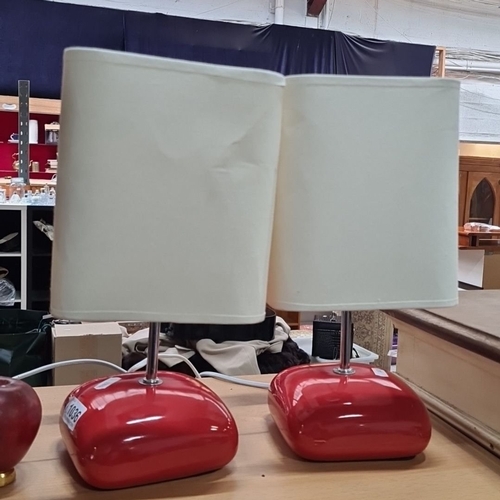 1036 - Star Lot :A Pair of mid century modern ceramic table lamps with red bases and white rectangular fabr... 