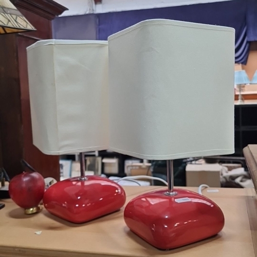 1036 - Star Lot :A Pair of mid century modern ceramic table lamps with red bases and white rectangular fabr... 