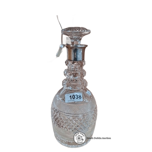 1038 - A Cut crystal decanter with sterling silver collar, marked with British hallmarks, from mid 20th cen... 