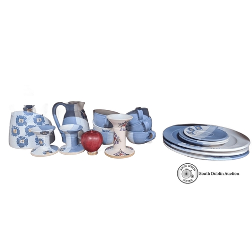 1044 - A pottery set by Suzanne May, featuring hand-painted blue floral and stripe designs. Includes plates... 