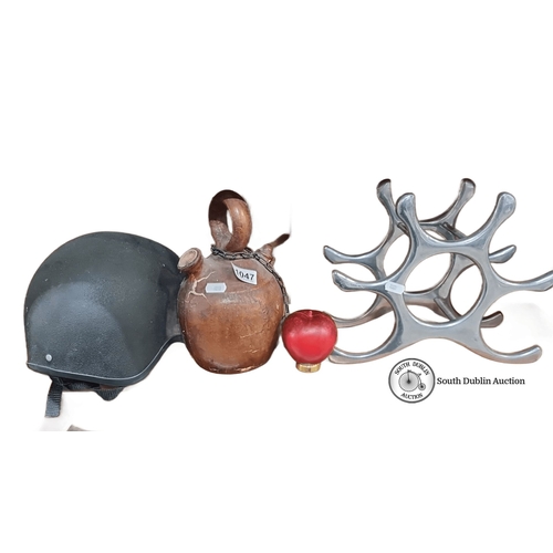 1047 - Mixed lot containing a Champion Junior Plus Jockey Helmet, leather jug with chain and a polished met... 