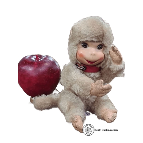 1061 - A Vintage schuco plush monkey toy featuring realistic facial features and articulated limbs. It has ... 