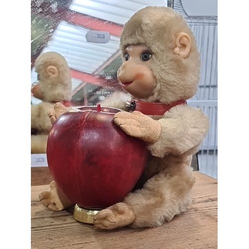 1061 - A Vintage schuco plush monkey toy featuring realistic facial features and articulated limbs. It has ... 