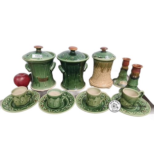 1062 - A lovely selection of castle arch pottery Including lidded jars, candlestick holders, cups, and sauc... 