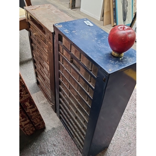 1064 - Pair of vintage multi-drawer storage cabinets with individual labelled bins.