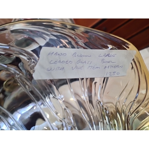 1065 - A large Hand-blown leaded art glass bowl with vine stem pattern.