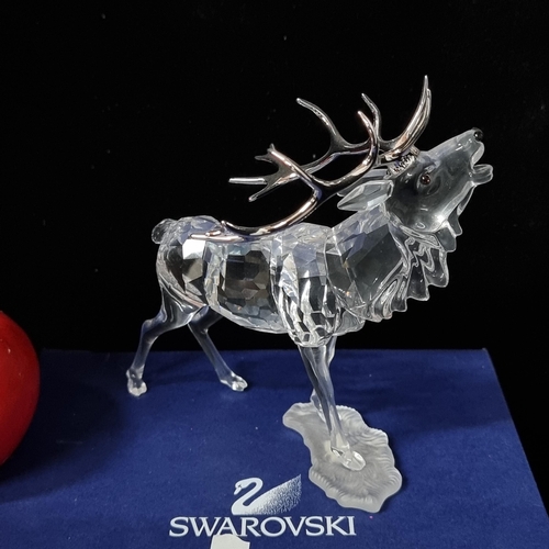 723 - Star Lot: A fabulous Swarovski Crystal Stag designed by Adi Stocker. The Stag was part of the “Rare ... 