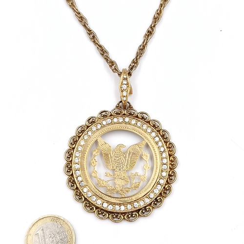 1007 - A gold toned necklace with an American eagle diamante medallion. Total length of chain 60cm.