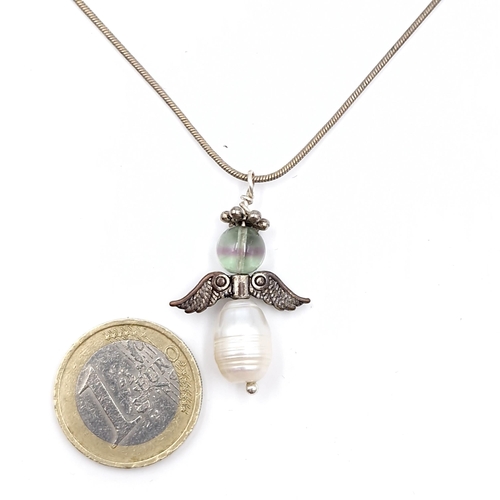 1014 - A sterling silver angle baroque pearl pendant necklace. Stamped 925 to chain.  With a large natural ... 