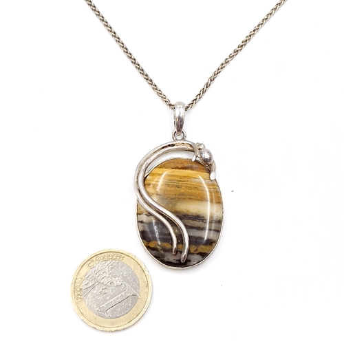 1016 - A lovely example of an Italian made sterling silver tigers eye pendant necklace. Total length of cha... 