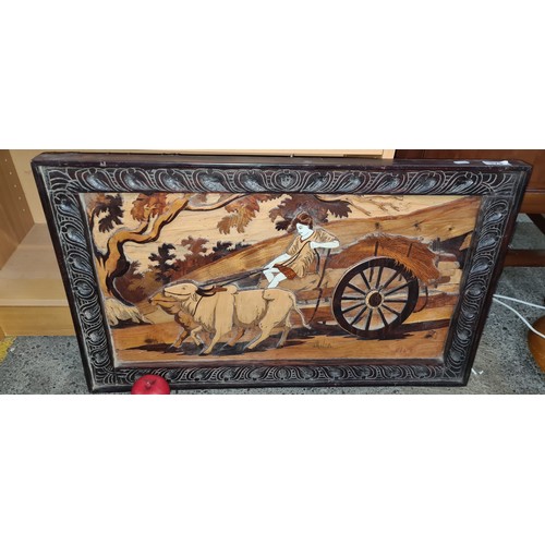 379 - Star Lot : A wonderful large hand carved rosewood picture depicting a traditional Asian scene of a y... 