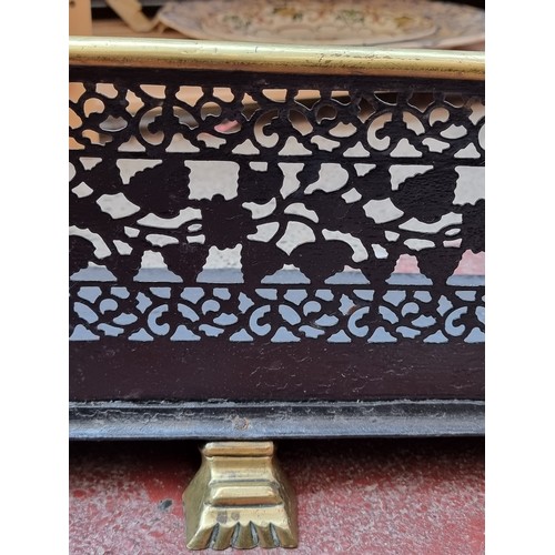 1134 - Star Lot : A very handsome  vintage brass fire surround with lion paw feet. MM: 109cm

Previous in a... 