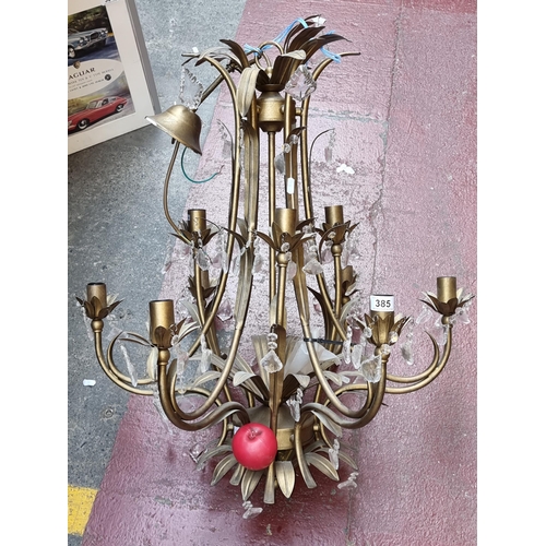 1146 - An large elaborate 8 branch brass toned chandelier ceiling light with glass drop accents.

Previous ... 