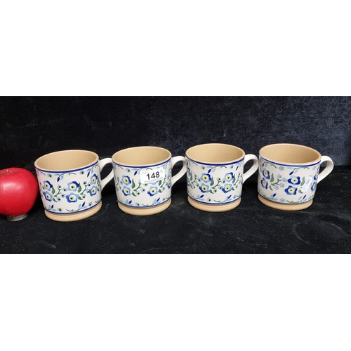 148 - A set of four Nicholas Mosse art studio pottery drinking mugs with handles. All in good condition wi... 