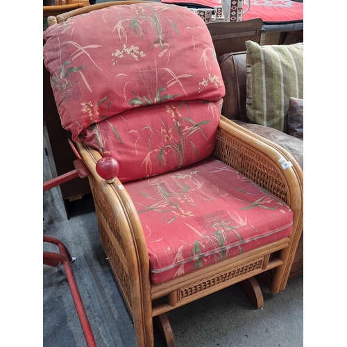 1177 - A very comfortable bamboo chair with tropical themed cushioned back and seat

Previously in Auction ... 