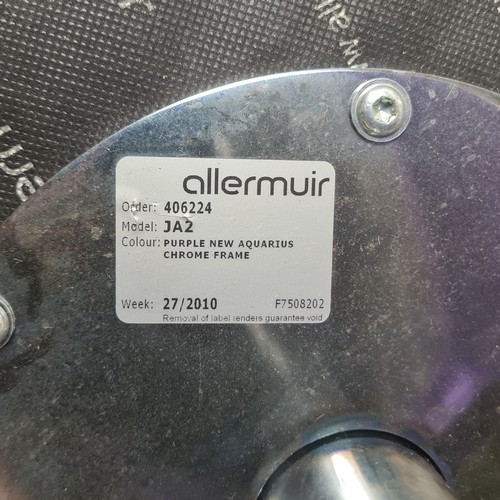 1179 - Star lot : A designer Allermuir purple lounge chair with matching ottoman, featuring polished chrome... 