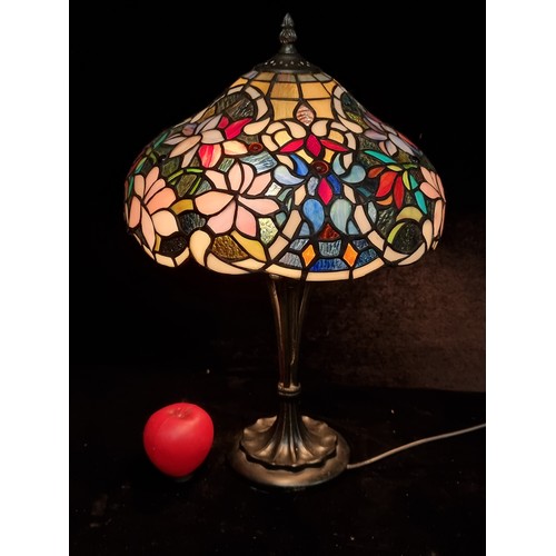 162 - Star Lot  : An elegant Tiffany style table lamp with art nouveau accented base.