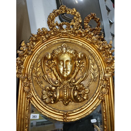 383 - Star Lot : A gorgeous and very elegant tall French gold gilt bevelled mirror with a female mask deco... 