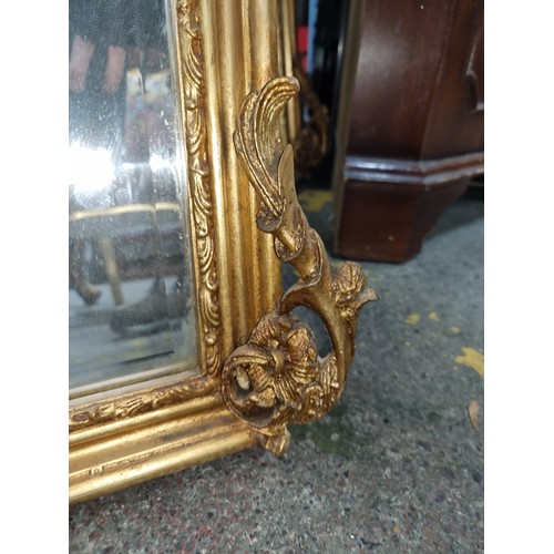 383 - Star Lot : A gorgeous and very elegant tall French gold gilt bevelled mirror with a female mask deco... 