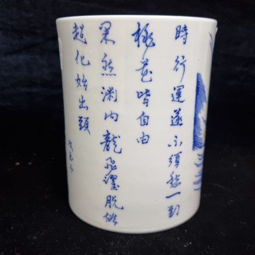 521 - Star Lot : A 19th century fabulous ceramic Chinese brush pot in a blue and white pattern featuring a... 