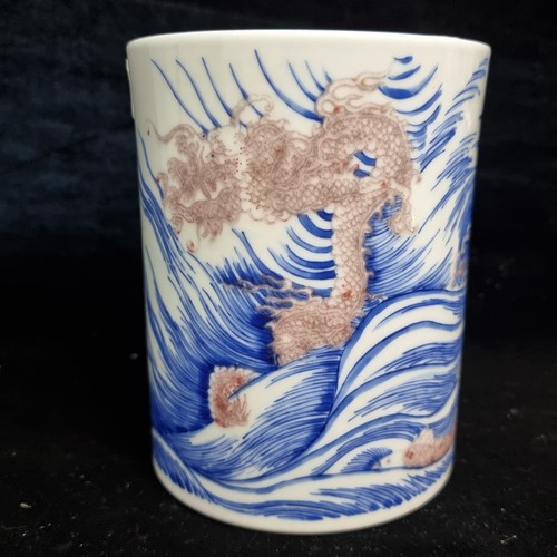 521 - Star Lot : A 19th century fabulous ceramic Chinese brush pot in a blue and white pattern featuring a... 