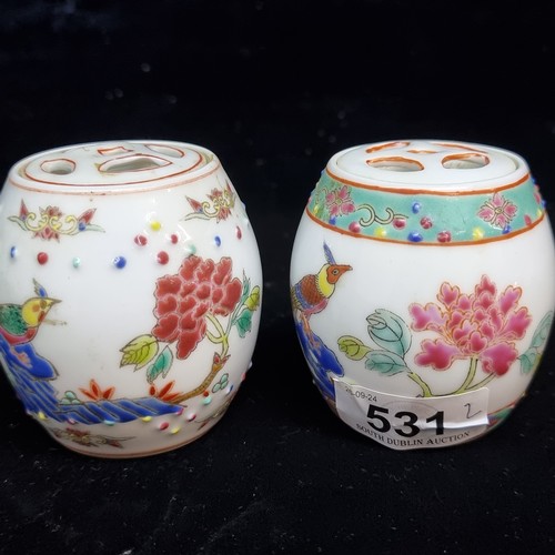 531 - A lovely pair of miniature Chinese hand painted famille rose porcelain lidded jars. Both stamped to ... 