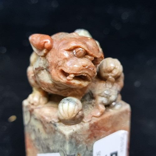 552 - A Chinese Soapstone seal with a Lion and cub to top. Features handle carved as a lion and cub, emble... 