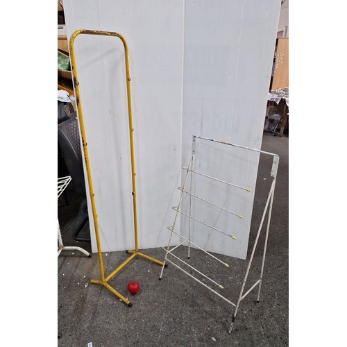 897 - Pair of metal display stands, one in yellow and the other white. Lot includes an additional small re... 